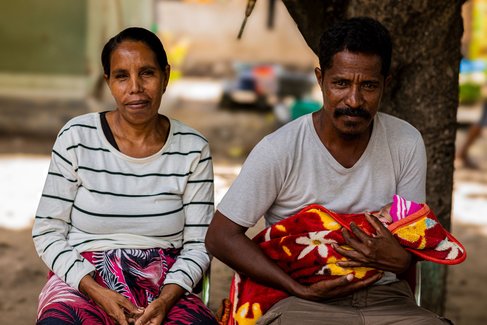 Mother, Father, and their baby in health facility 01-Post  small